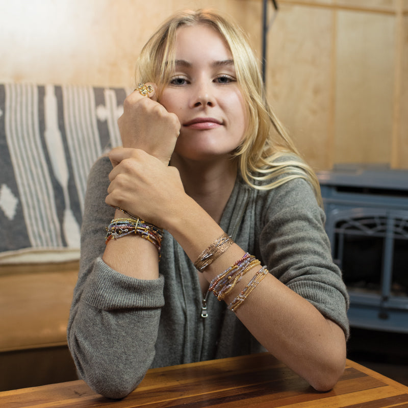 Pyrite's Booty Bracelet in 2mm Lapis with Disc Charms